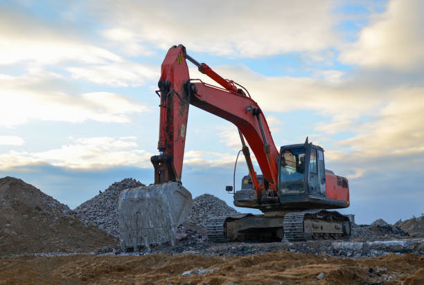 istock Excavator loads of stone and rubble for processing into cement or concrete for construction work. 1197140254