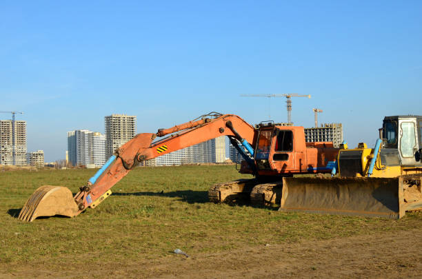 istock Crawler excavator with iron bucket and bulldozer at construction site. 1197140360