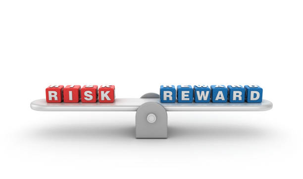 istock Seesaw with RISK REWARD Buzzword Cubes - 3D Rendering 1197141258