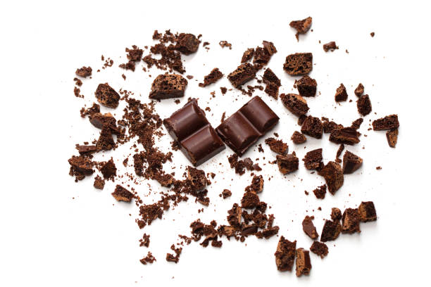 istock Chocolate crumbs with slices. Crushed chocolate on a white background 1197143651