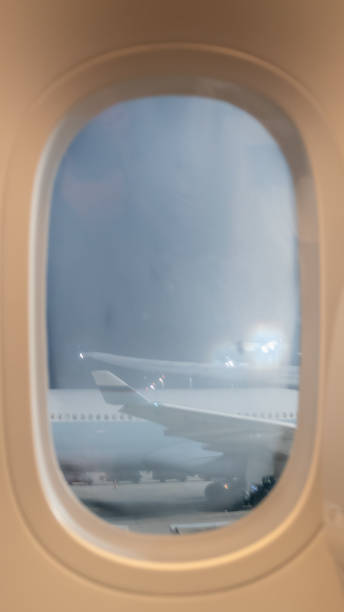 istock Airplanes at airport through window 1197147506