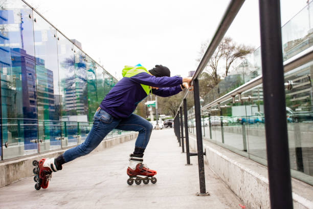 istock Young man skating and stretching in the street 1197149557