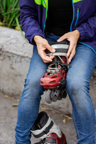 istock Person taking his roller skates and preparing to put them 1197150248