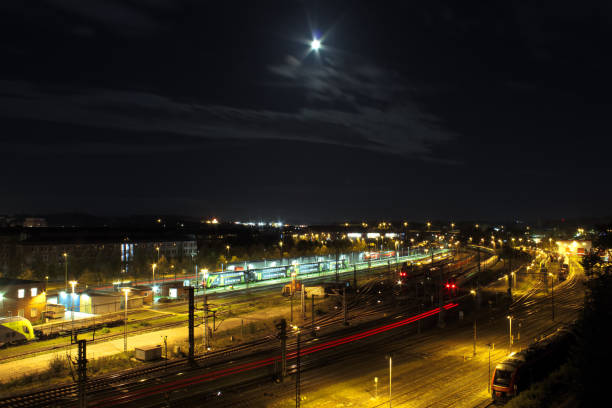 istock Long exposure of a train station at night 1197154550