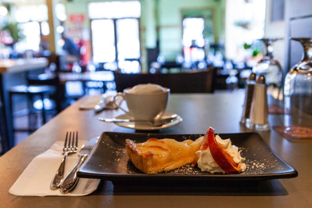 istock Apple tart served with cream in bistro 1197159919