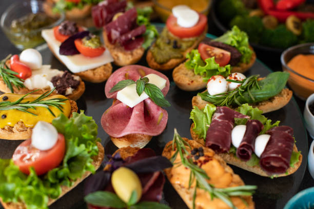 istock Many kinds of appetizer on the black table. 1197159922