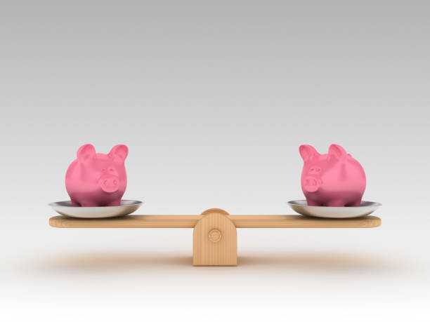 istock Seesaw Scale with Piggy Bank - 3D Rendering 1197161086