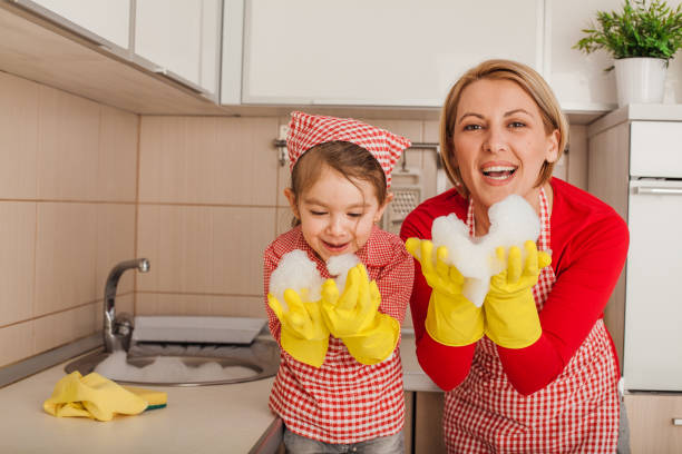 istock Mother and daughter cleaning the kitchen 1197161197