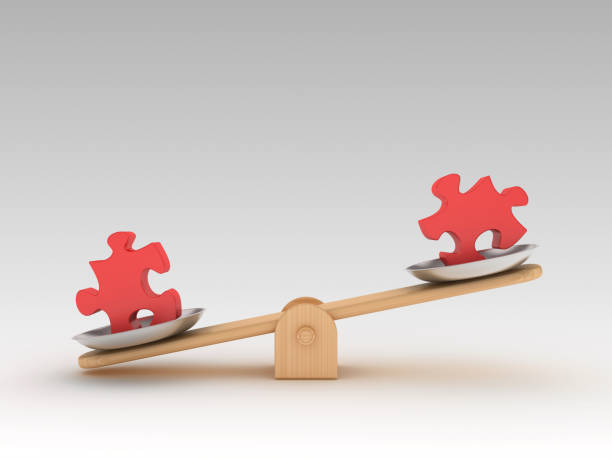 istock Seesaw Scale with Jigsaw Pieces - 3D Rendering 1197161326
