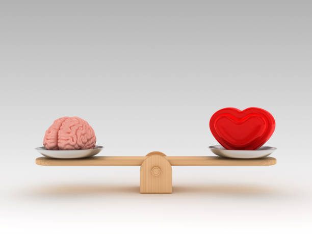 istock Seesaw Scale with Human Brains and Heart - 3D Rendering 1197161992