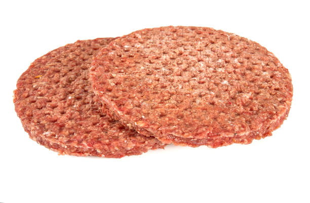 istock fresh raw burger patty isolated on white 1197163827