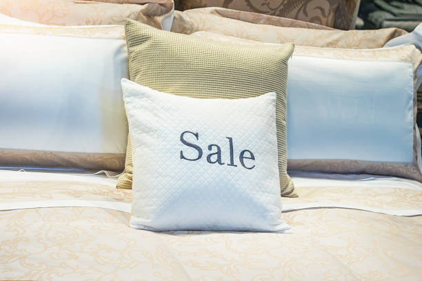 sale inscription on pillow in store - outdoors cushion pillow furniture imagens e fotografias de stock