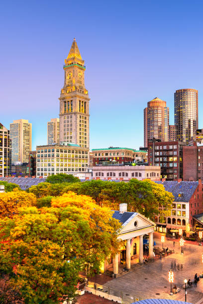 Boston, Massachusetts, USA skyline with Faneuil Hall and Quincy Market Boston, Massachusetts, USA skyline with Faneuil Hall and Quincy Market at dusk. boston skyline night skyscraper stock pictures, royalty-free photos & images