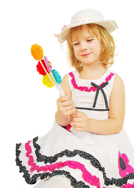 istock Little girl with lollipops  isolated 119717210