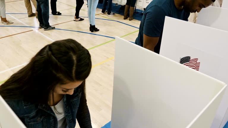 Voters vote in election at polling place