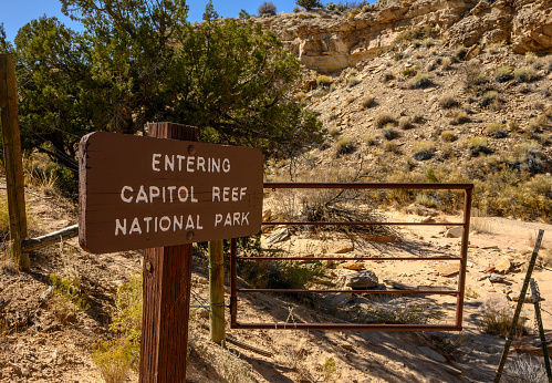 Entering Capitol Reef Sign and Gate at park boundary