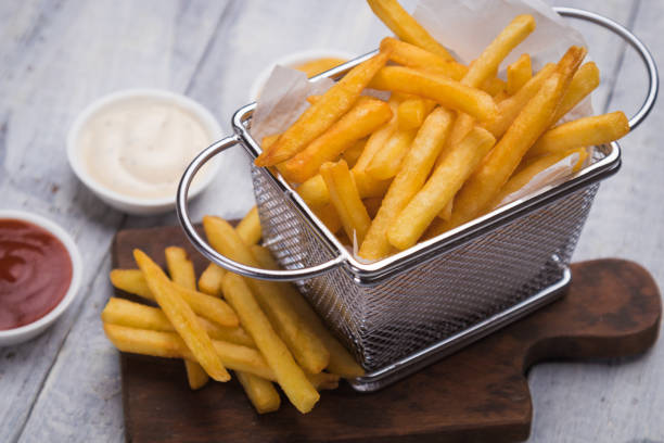 Home made french fries Home made french fries served in frying basket fried potato stock pictures, royalty-free photos & images