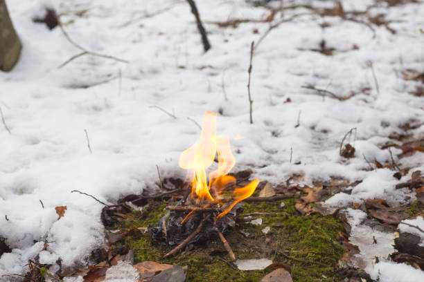 Husband and Wife Warming Up By the Campfire.