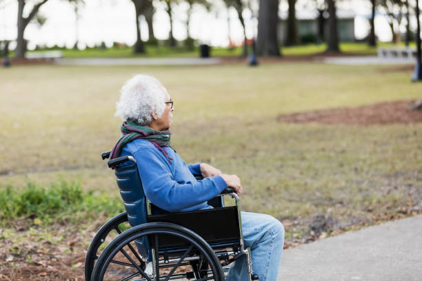 istock Senior Hispanic man in wheelchair, thinking 1197180756