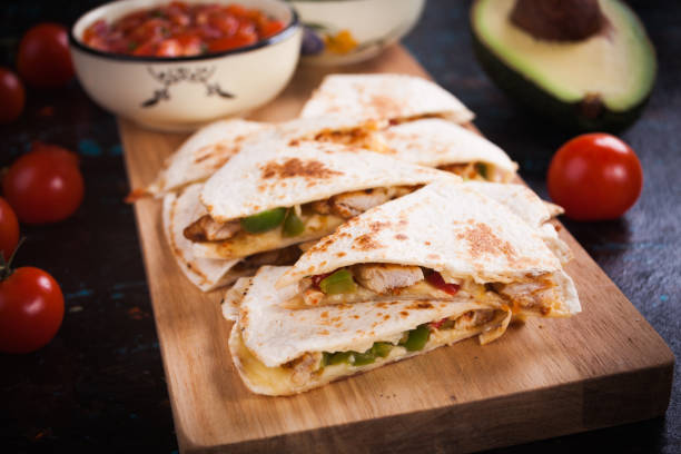 istock Mexican quesadilla, tortilla filled with cheese, meat and vegetables 1197181913