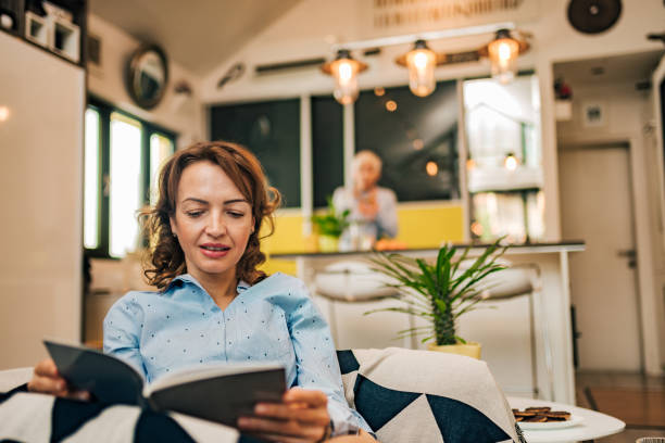 istock Charming woman reading a book, portrait. 1197182225