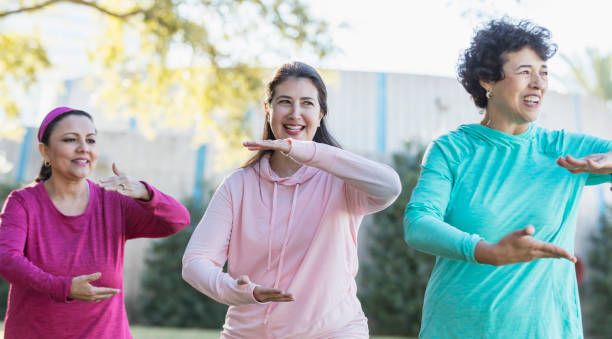 istock Three Hispanic women practicing tai chi together 1197183183