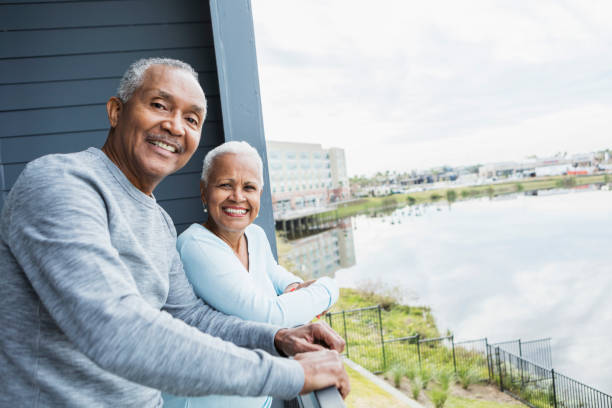 istock Senior couple looking at view from balcony 1197184417