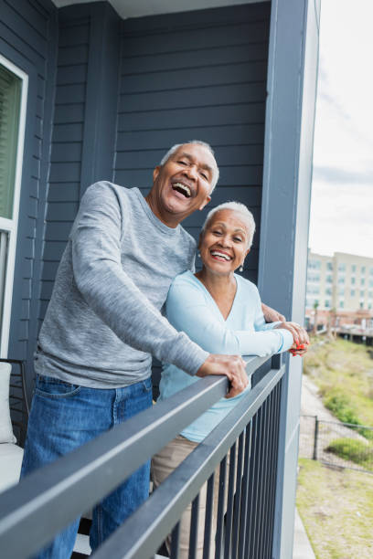 istock Senior couple looking at view from balcony 1197184561