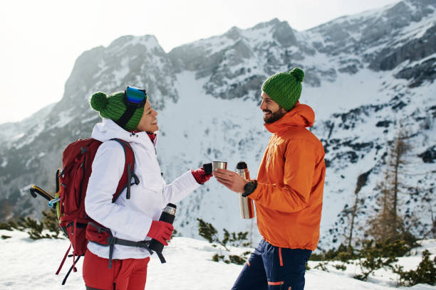 istock Young couple taking a break from hiking and drinking tea 1197185377