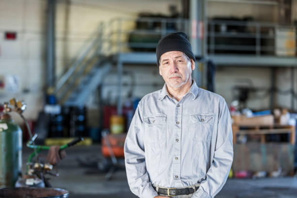 istock Senior Hispanic man working in repair shop 1197186829