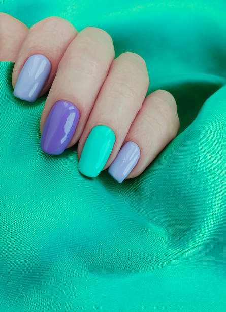 istock female hand nail manicure silk fabric 1197190378