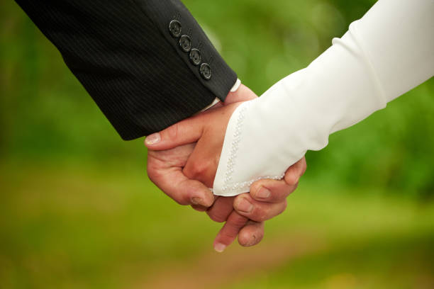 istock wedding couple hand in hand 1197193716
