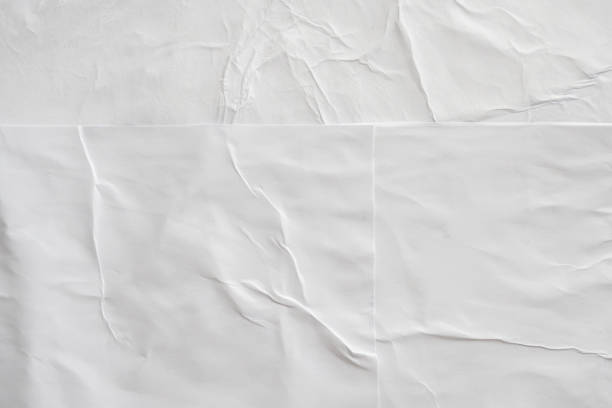istock Blank white crumpled and creased paper poster texture background 1197196924