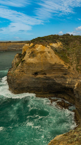 istock Waves crashing on Great Ocean Road Cliff 1197197203