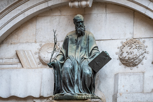 Bronze statue of Venetian patron Thomas Rangone (Tommaso Rangone) above the entrance of the Church of San Zulian, near San Marco Piazza Square in Venice city, Italy. He is known for curing syphilis.