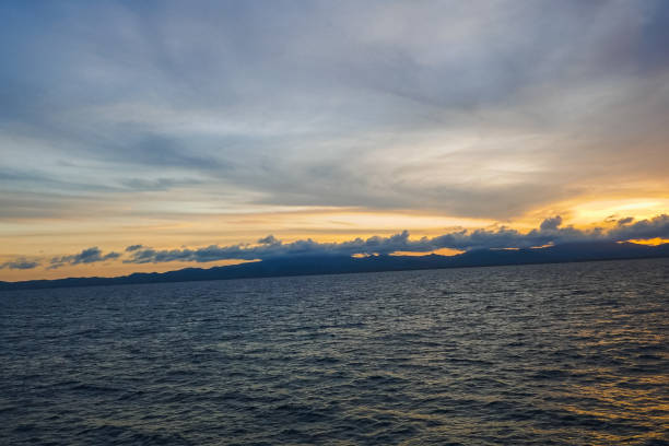 istock Sunset and sun rays with a dramatic sky over the Caribbean Sea 1197206108