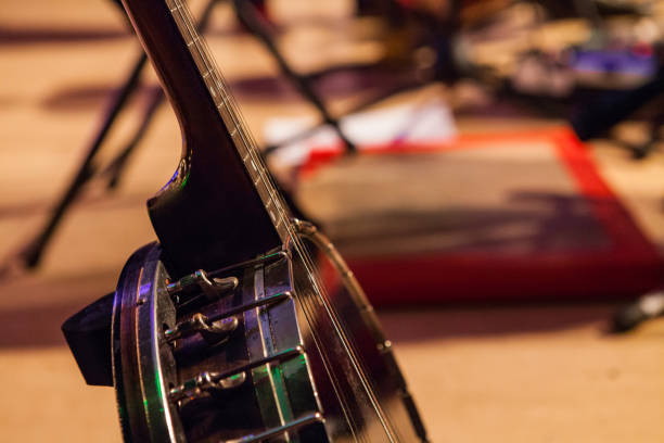istock Banjo on his stand, pictured on a stage with blurry feet tapping board 1197206307