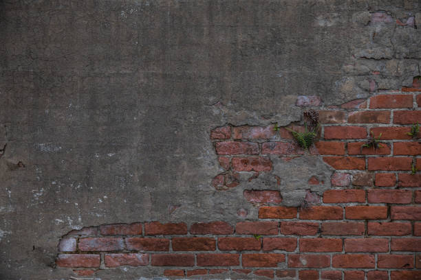 istock Old Red Brick and Mortar Concrete Wall Background Contrast 1197210694