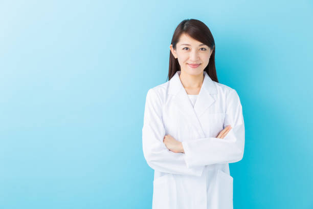 istock asian woman in a white coat 1197213100