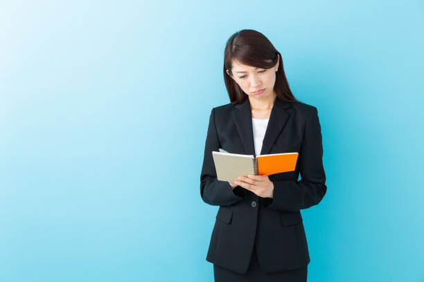 istock asian woman who fills out a notebook,think, 1197213749