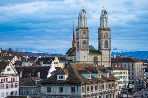 A view from the Altstadt, or old town, of Zürich, Switzerland. Prominent in the cityscape is the Grossmünster (or Großmünster) Romanesque-style Protestant church.