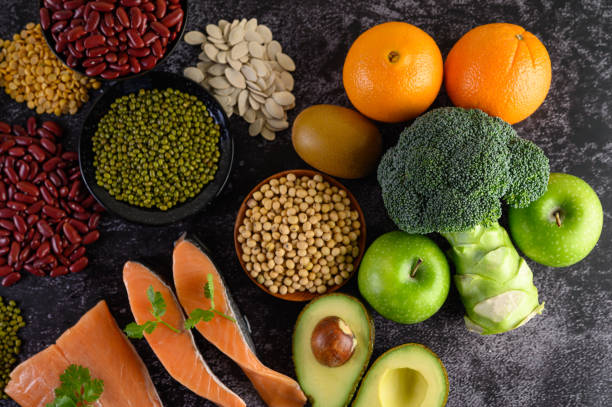 istock Legumes, and beans assortment on the black cement floor. Top view. 1197221349