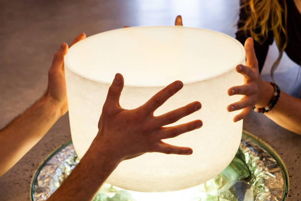 Couple holding a crystal bowl together