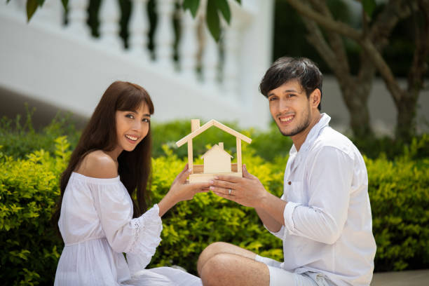istock Happy Romantic Couples lover talking and drinking wine while having a picnic at home 1197224195
