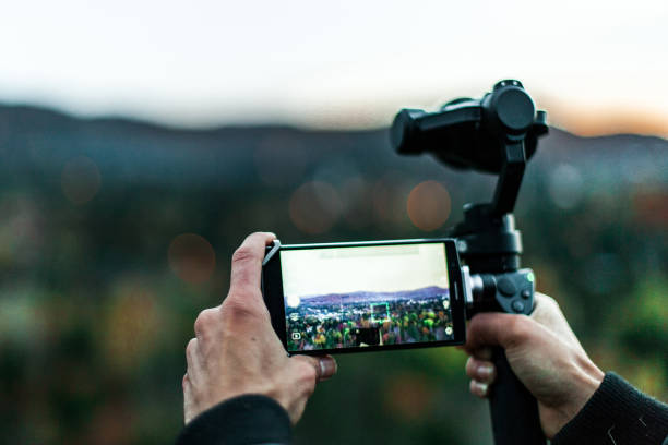 istock Filming with a gimbal and a mobile phone 1197227249