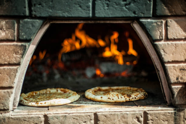 istock Handmade pizzas cooking in the oven 1197231188