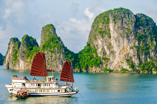 Bai Tu Long Bay, Vietnam; May 30, 2014. A cruise ship at anchor among karst islands in Bai Tu Long Bay.