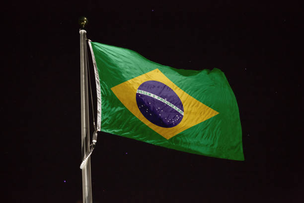 istock Brazil flag blowing in the wind at night 1197231473