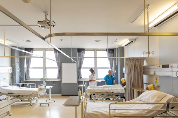 Empty modern hospital or school corridor, clinic hallway interior in yellow-white collor and led lighting