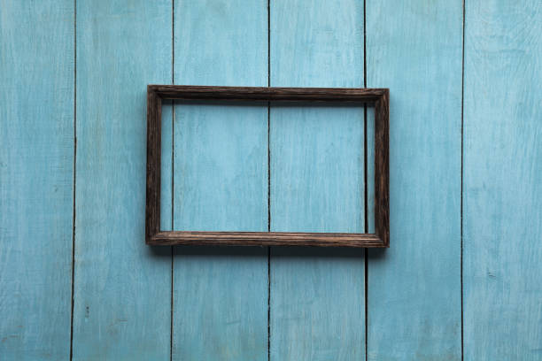 istock photo frame on wooden wall 1197232278
